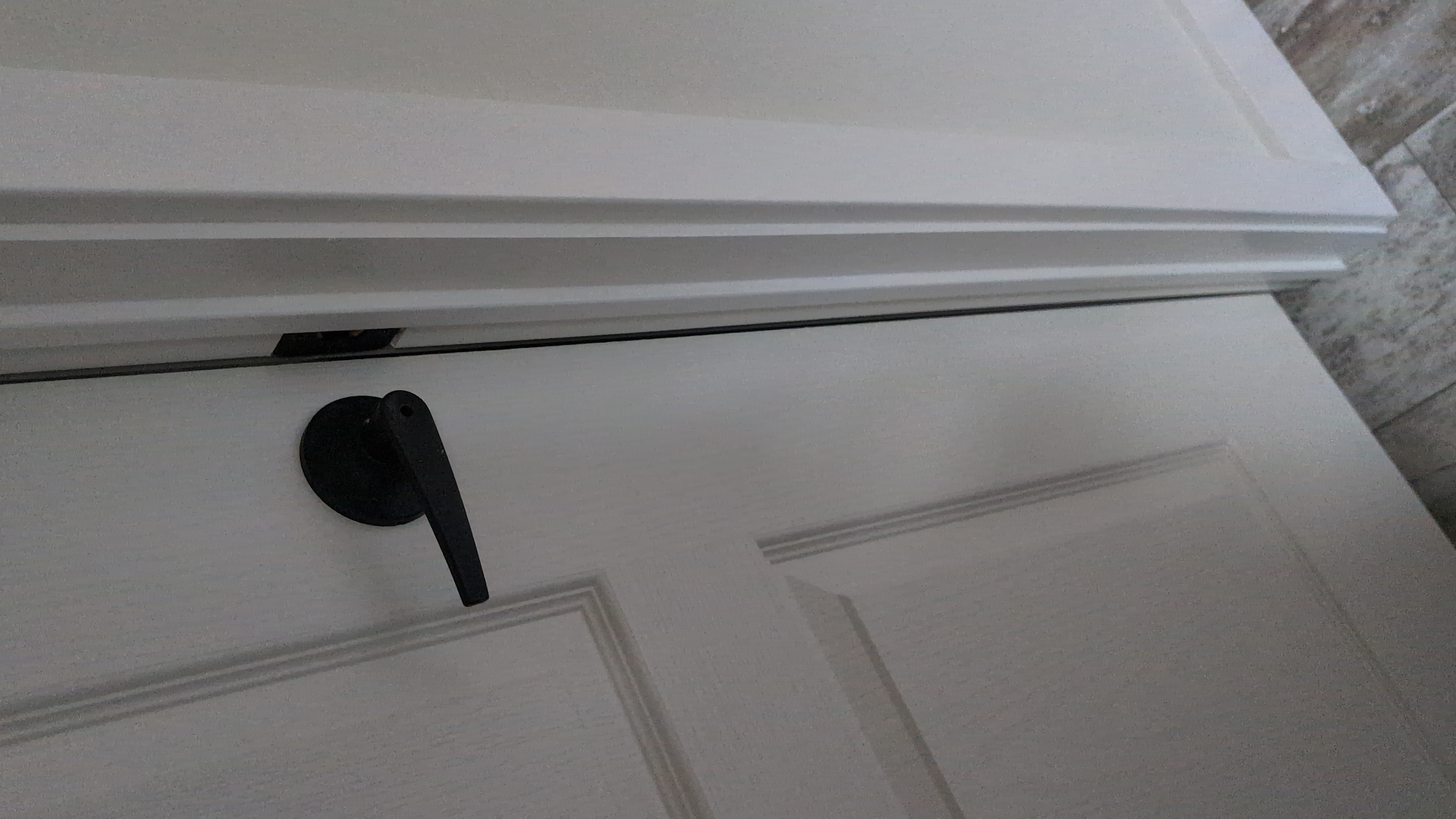 Bathroom door frame misalignment visible