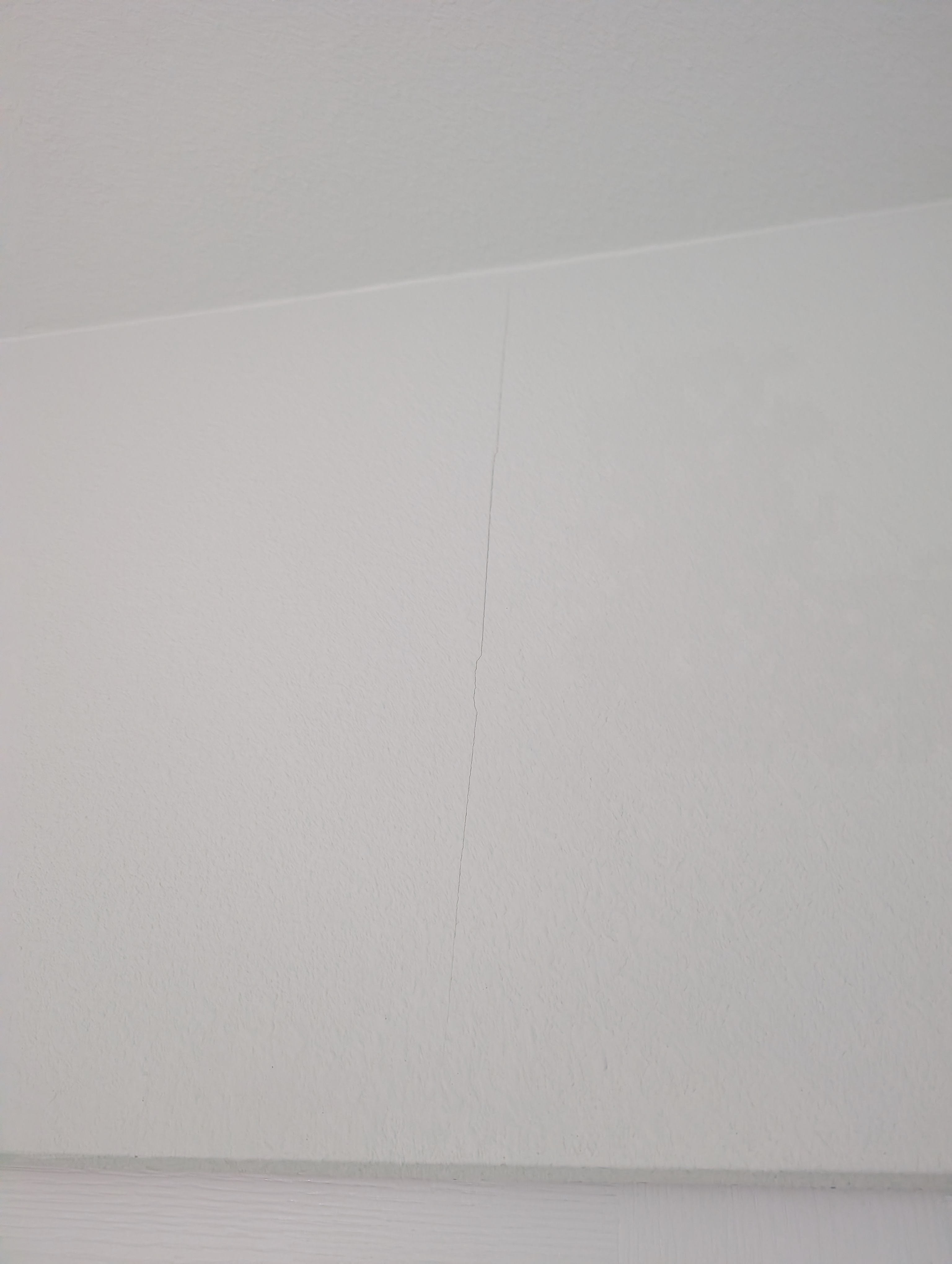 A vertical wall crack is visible in Bathroom 1 under night lighting.