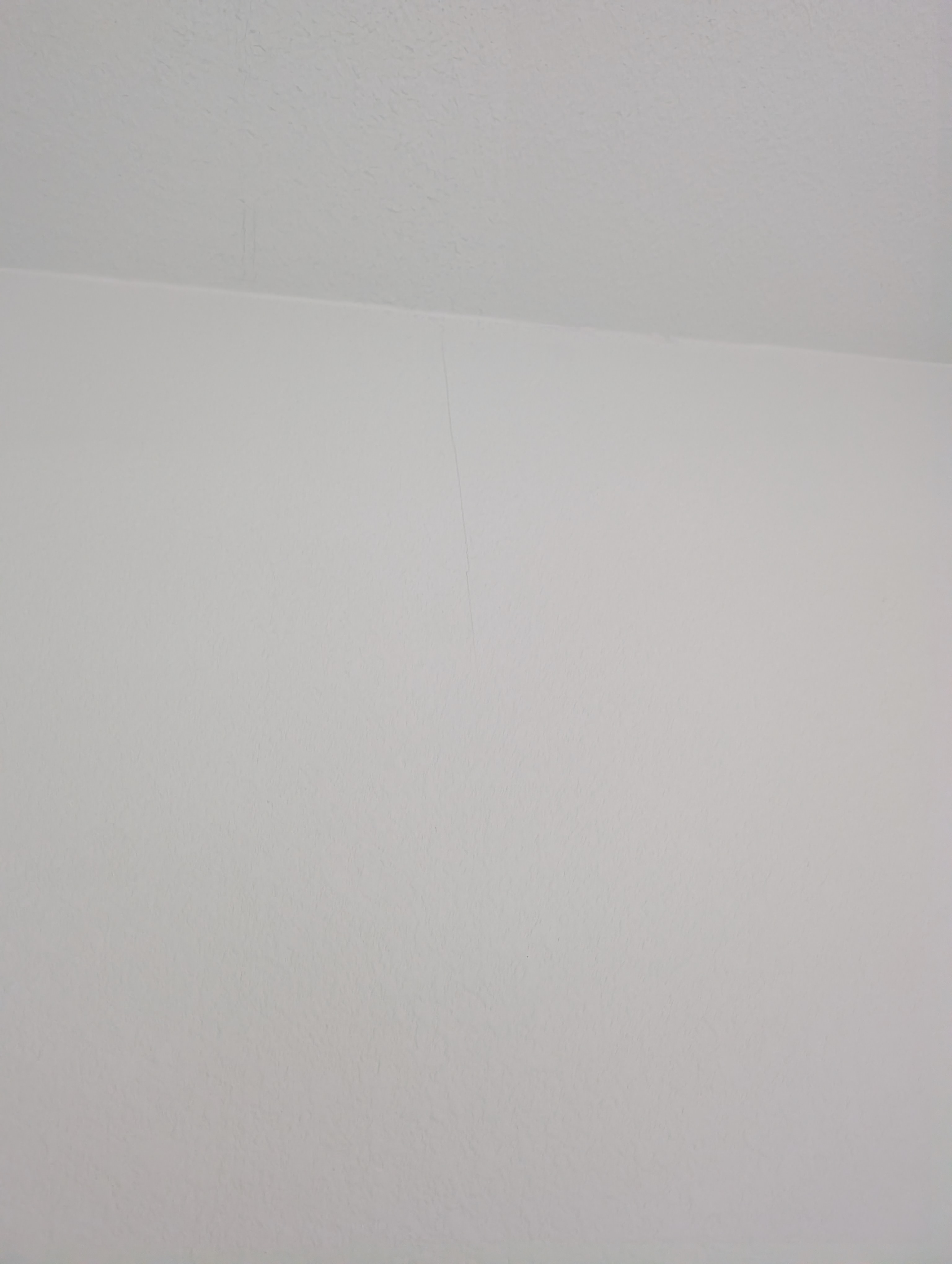 A close-up view shows hairline cracking along the wall in Bathroom 1.