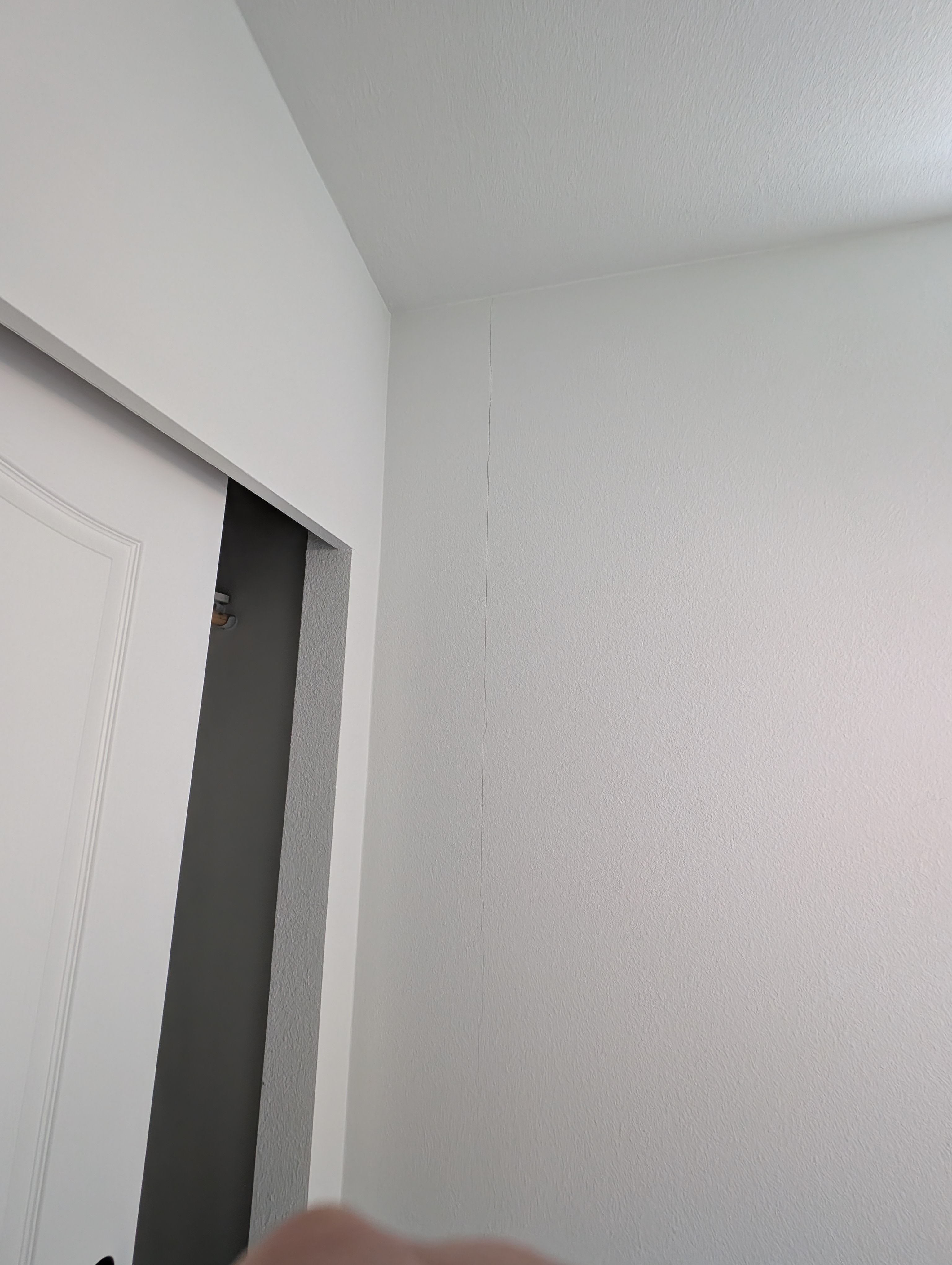 A vertical crack is visible on the wall surface in Bathroom 2.