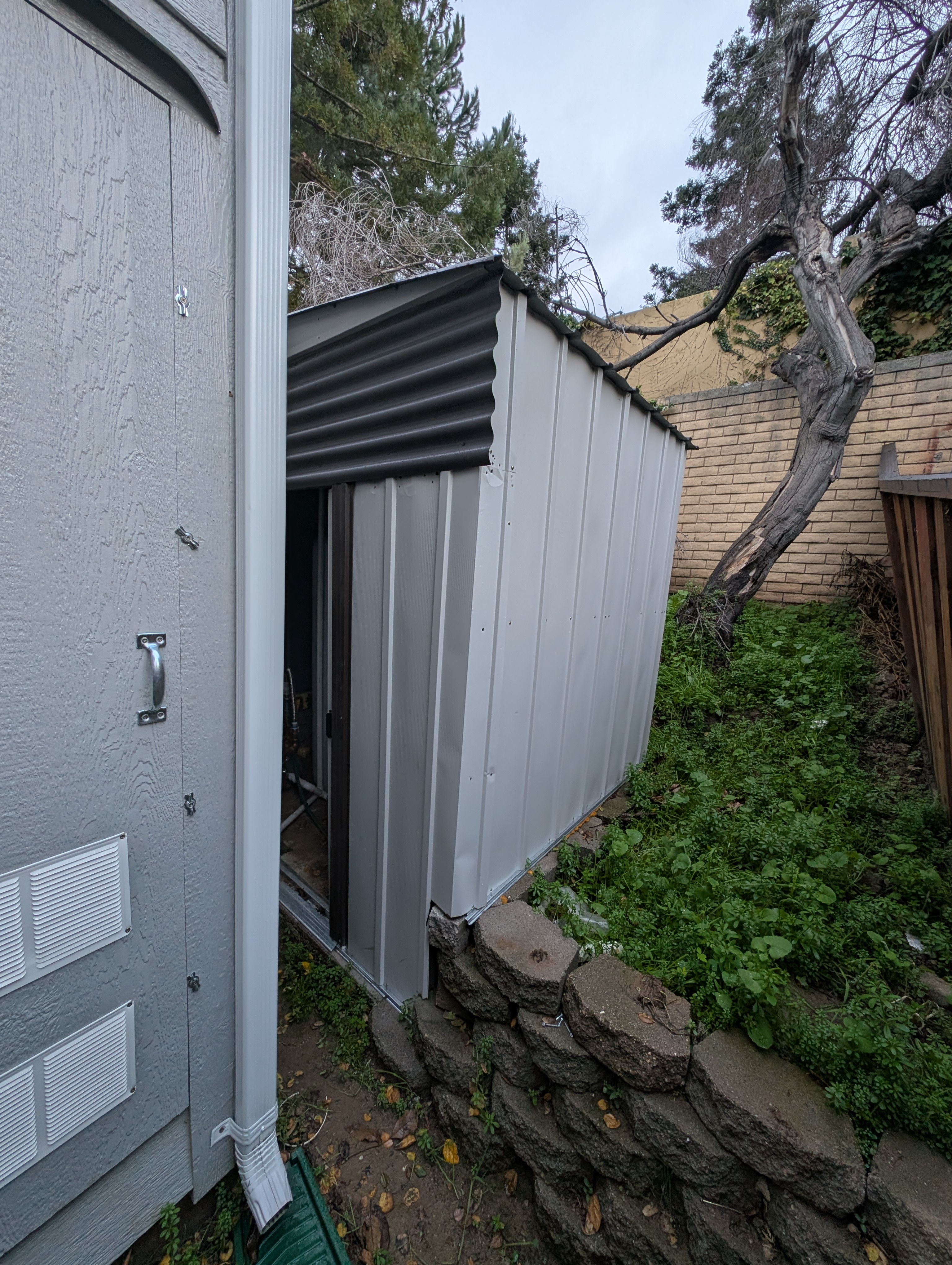 The water heater compartment was left open, exposing internal components to the exterior environment.