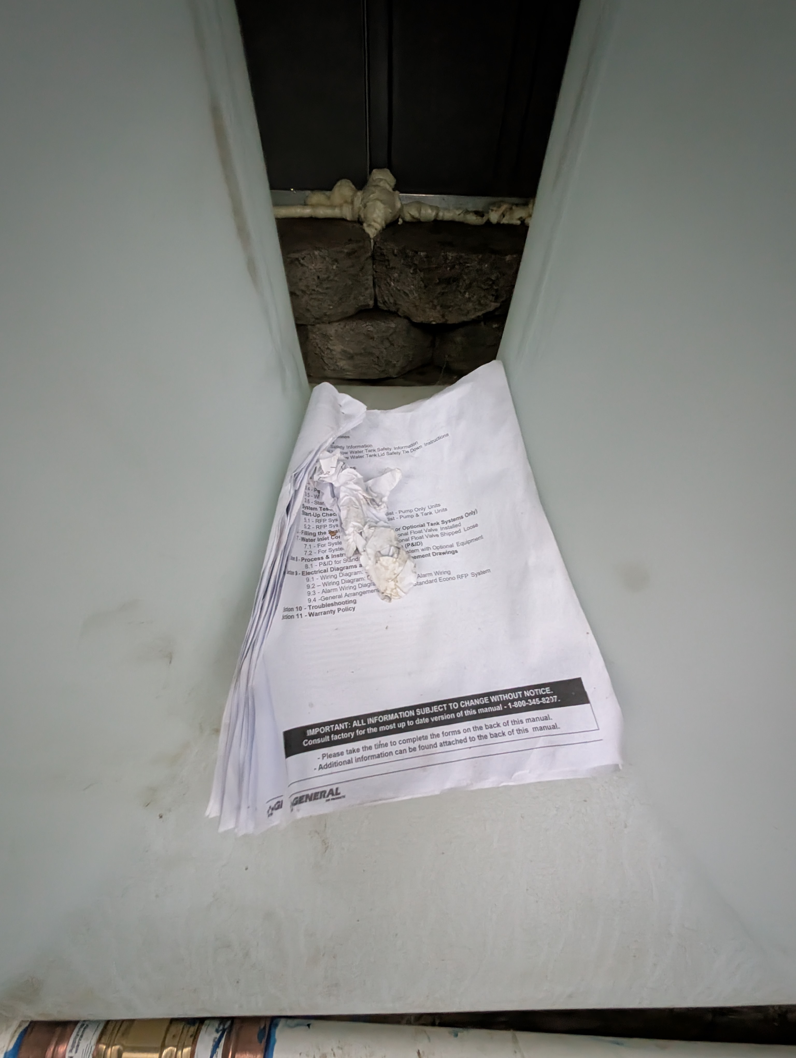 The access door was not properly fastened, showing a lack of attention to securing the water heater enclosure.