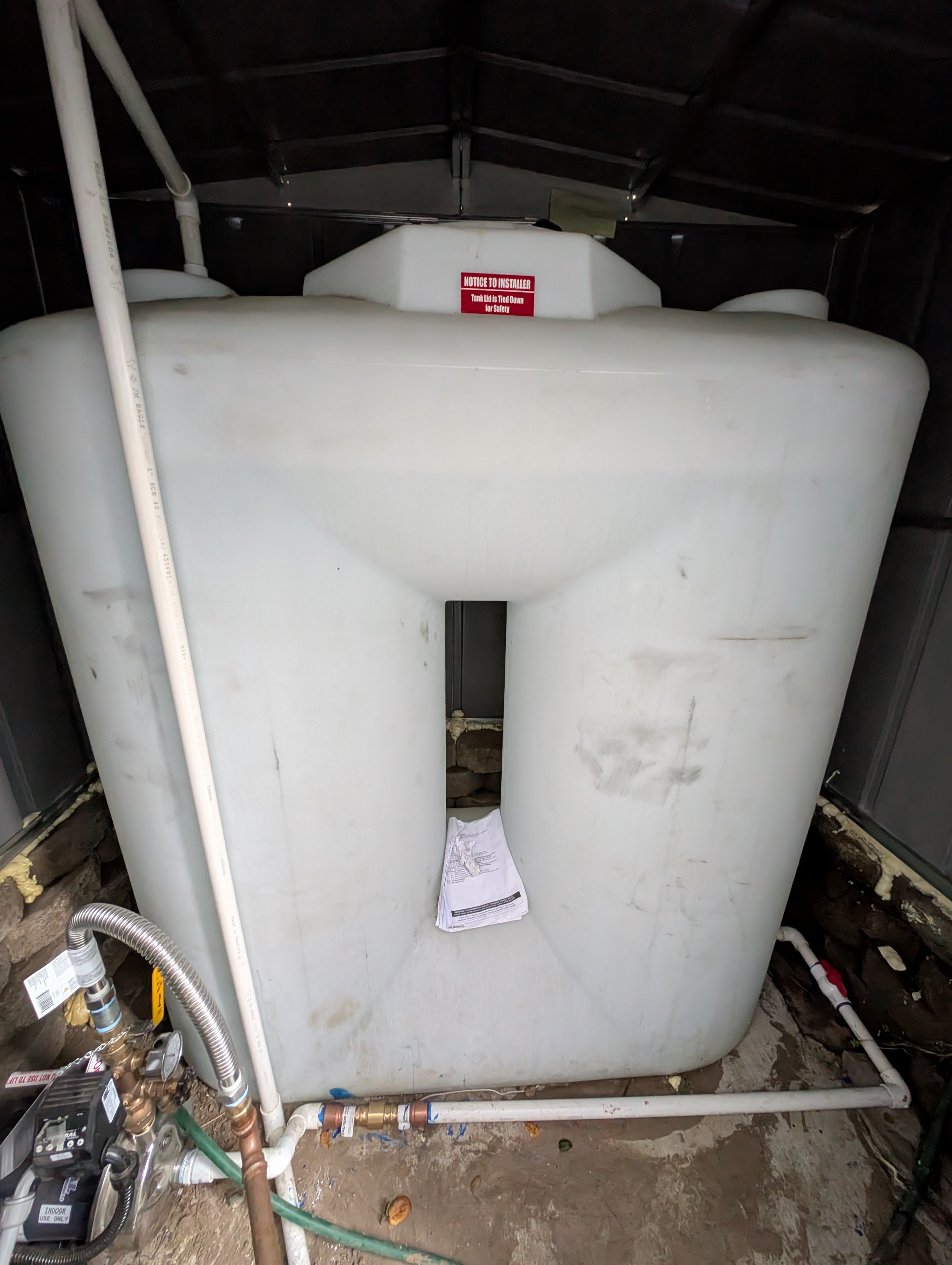 An alternate angle further documents that the water heater access panel remained open and unattended.