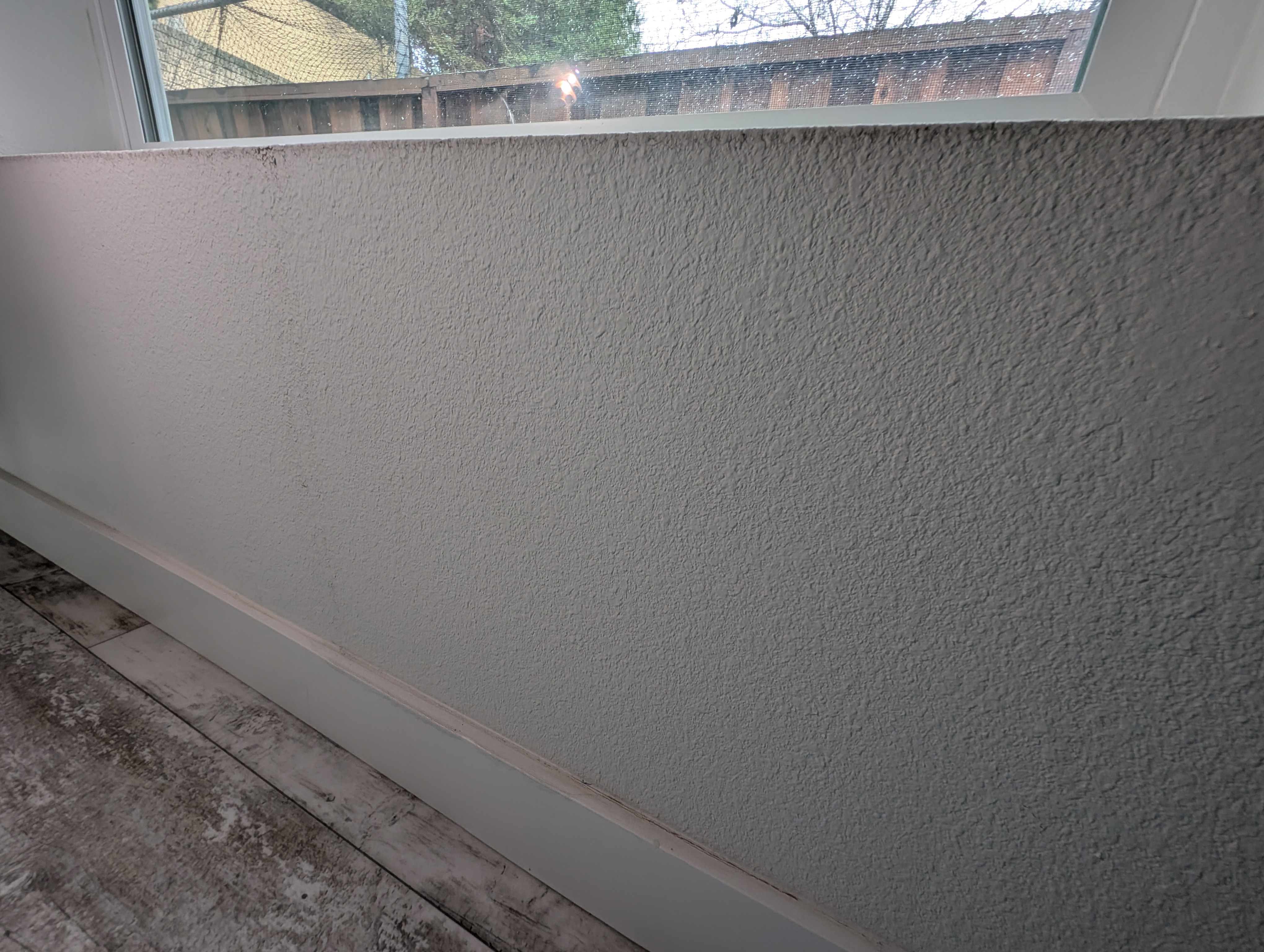 Watermarks and discoloration on wall (night photo)